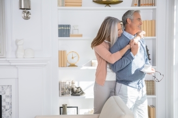 couple by bookcase